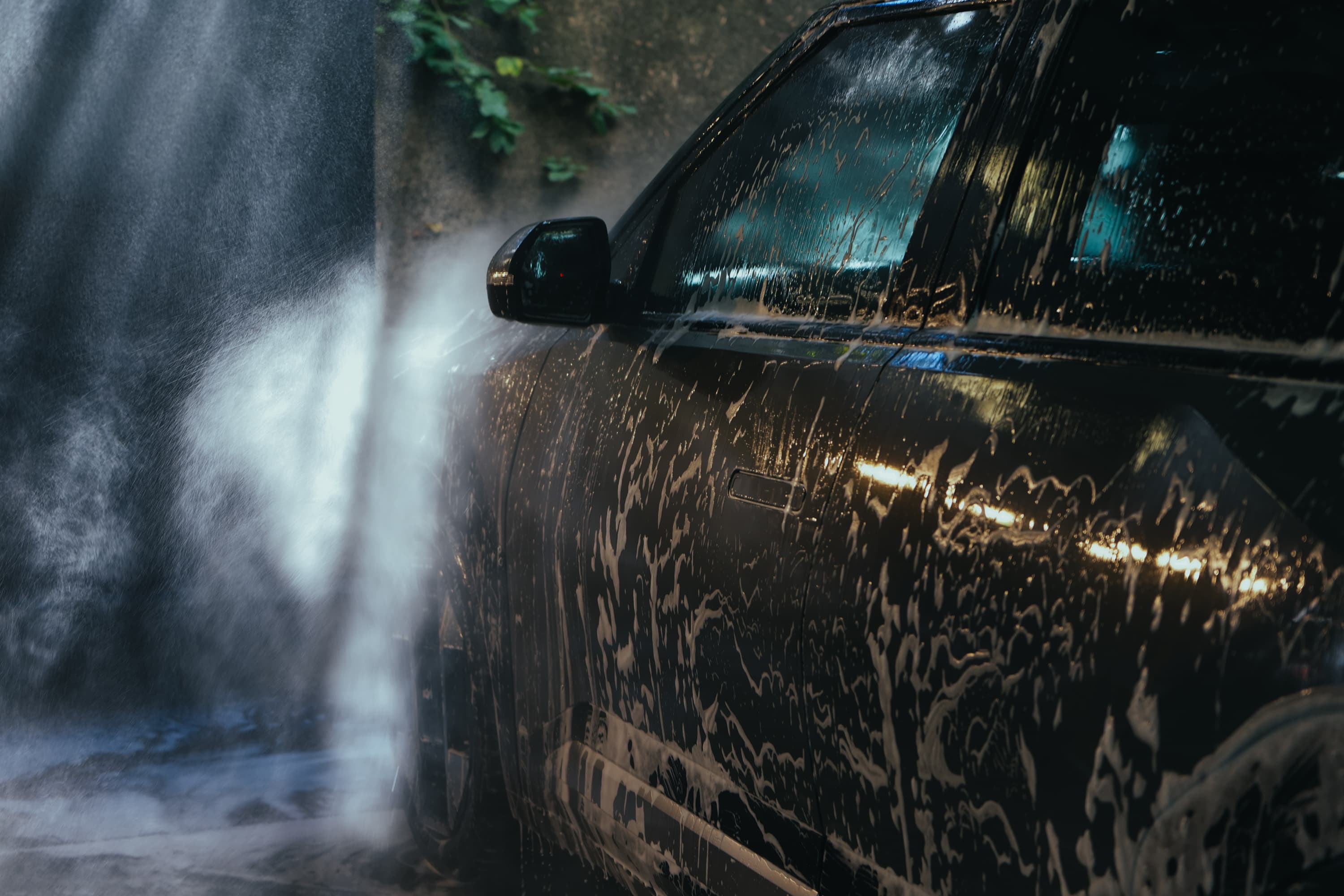 Thick foam wash on a black SUV during a CLTCH mobile detail
