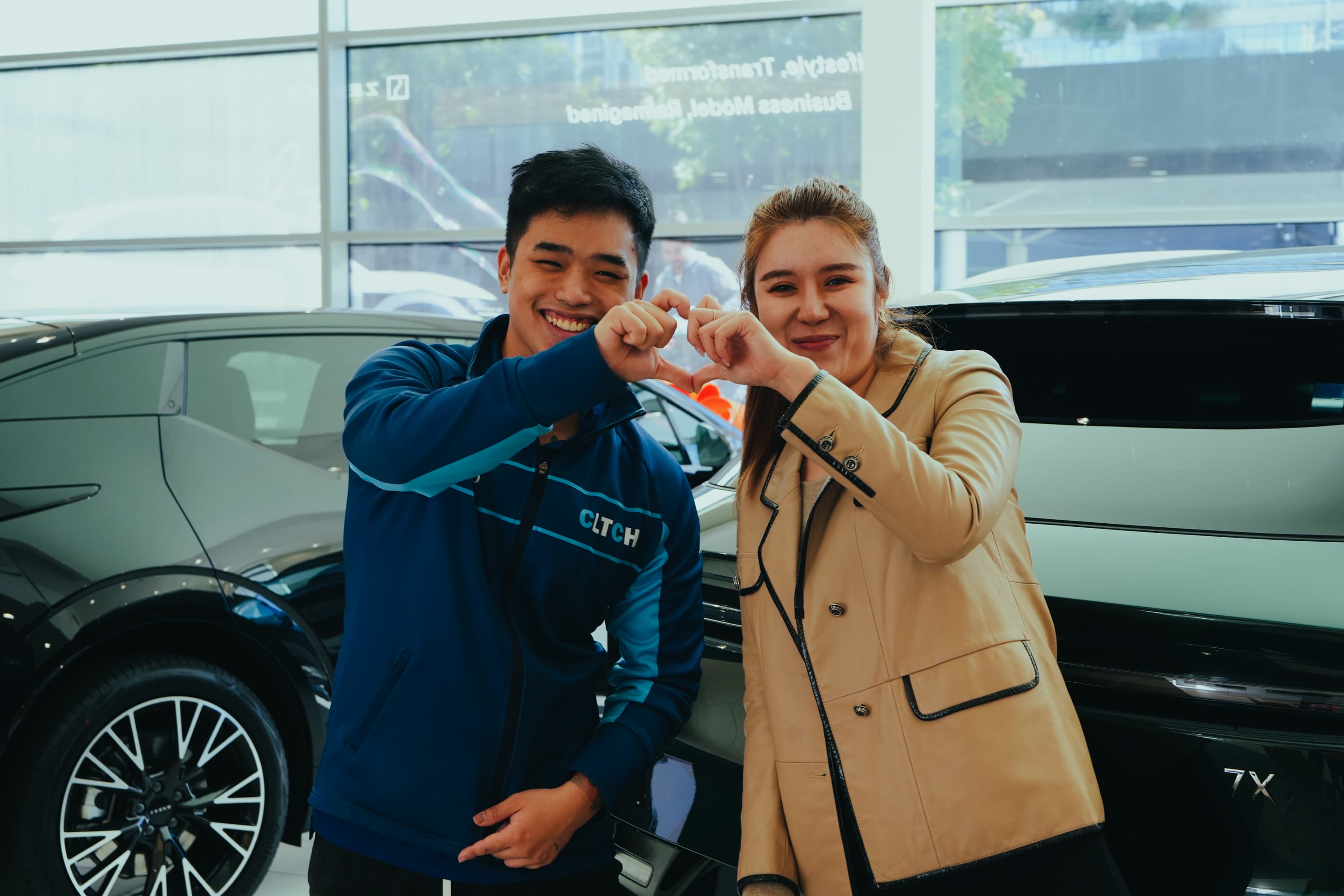 A happy customer and CLTCH detailer in the showroom