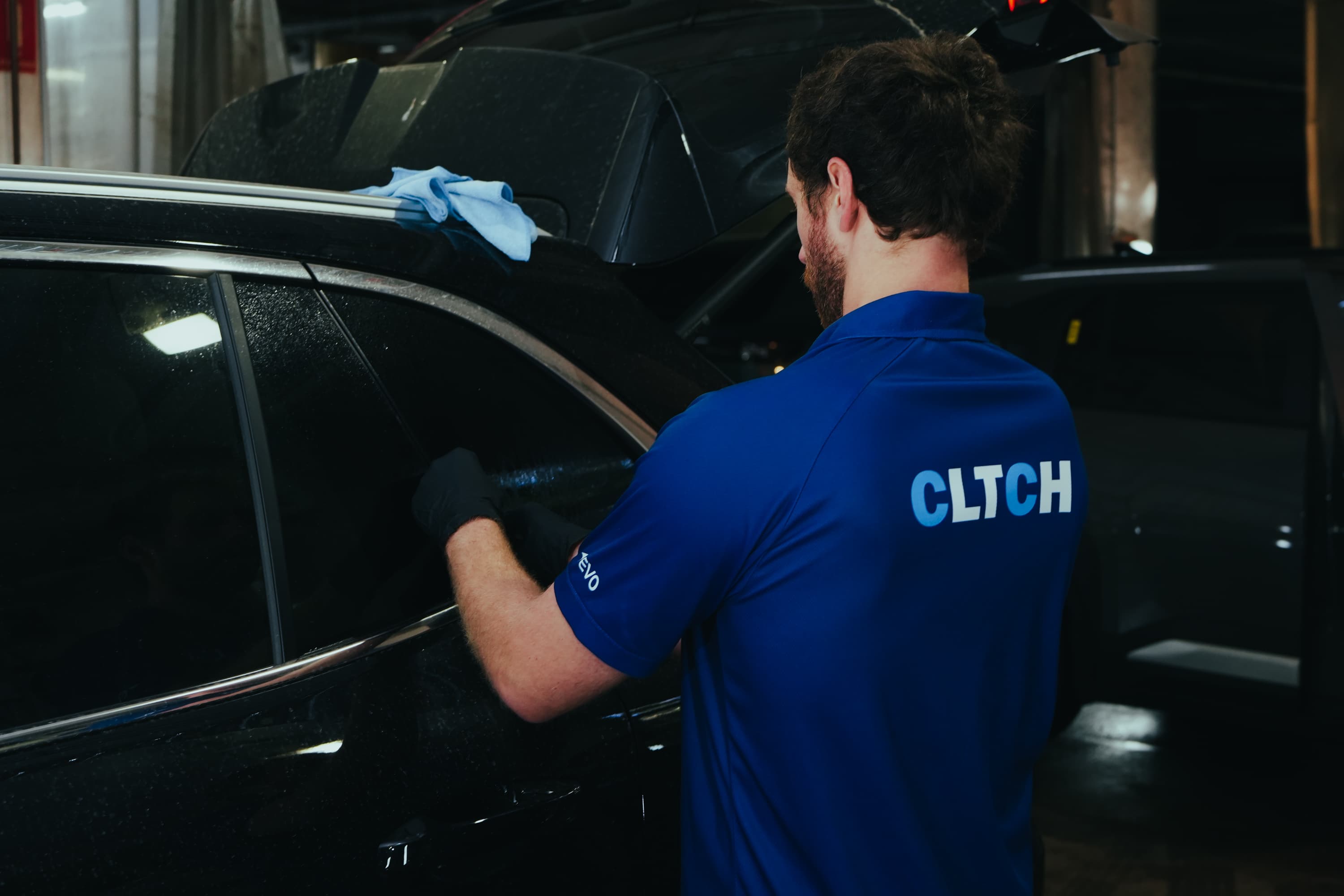 CLTCH technician prepping auction stock the night before sale