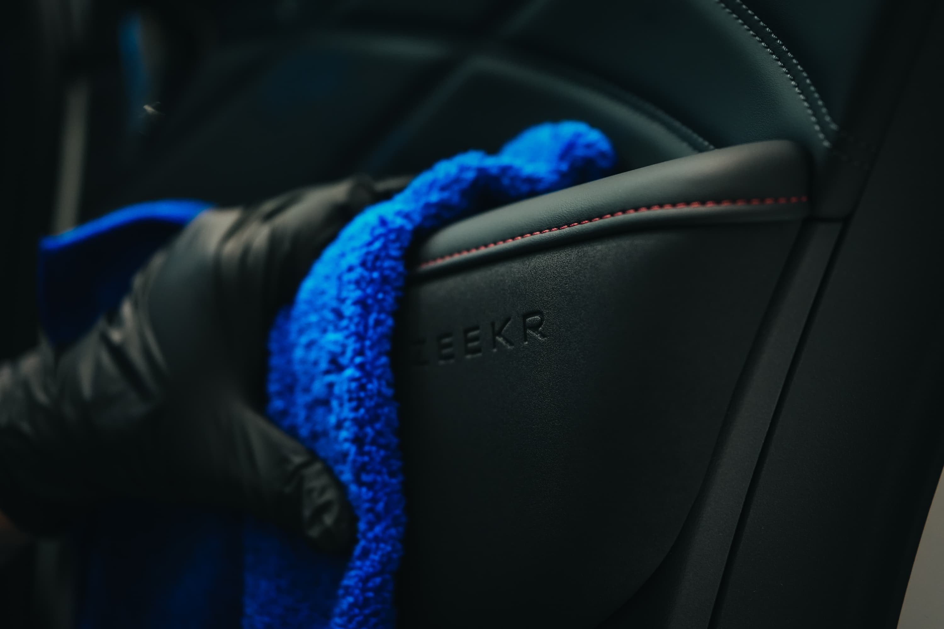 Protective detail work on embossed seat trim
